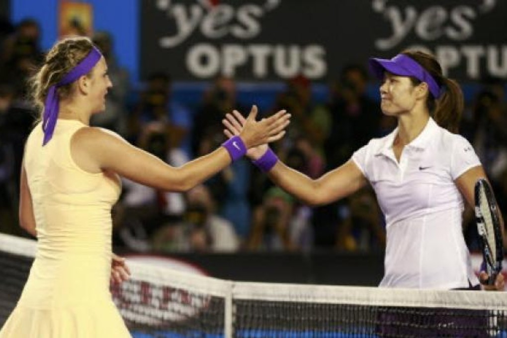 Victoria Azarenka of Belarus (left) with Li Na of China after defeating her in their singles final at the Australian Open tennis tournament on Saturday. Photo: Reuters