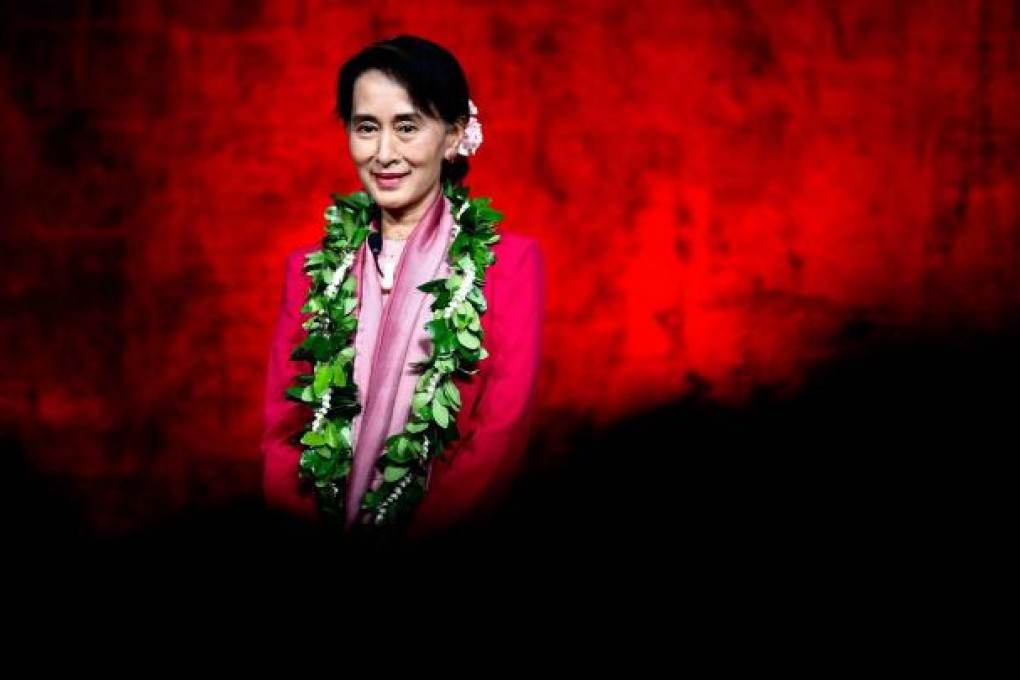 Myanmar's democracy leader Aung San Suu Kyi smiles on stage before speaking at a Pillars of Peace event at the Neal S. Blaisdell Centre in Honolulu, Hawaii. Photo: EPA