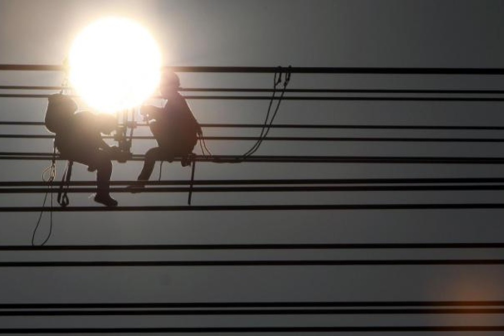 A recent rise in infrastructure and real estate investments is predicted to fuel profit growth before peaking in the third quarter. Photo: AFP