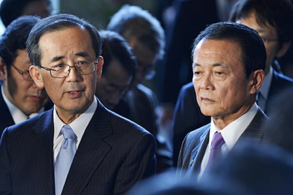 Bank of Japan Governor Masaaki Shirakawa (left) and Finance Minister Taro Aso in Tokyo. Photo: EPA