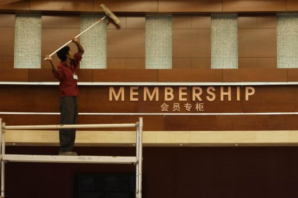 A worker cleans the facade at a Singapore casino. Photo: Reuters