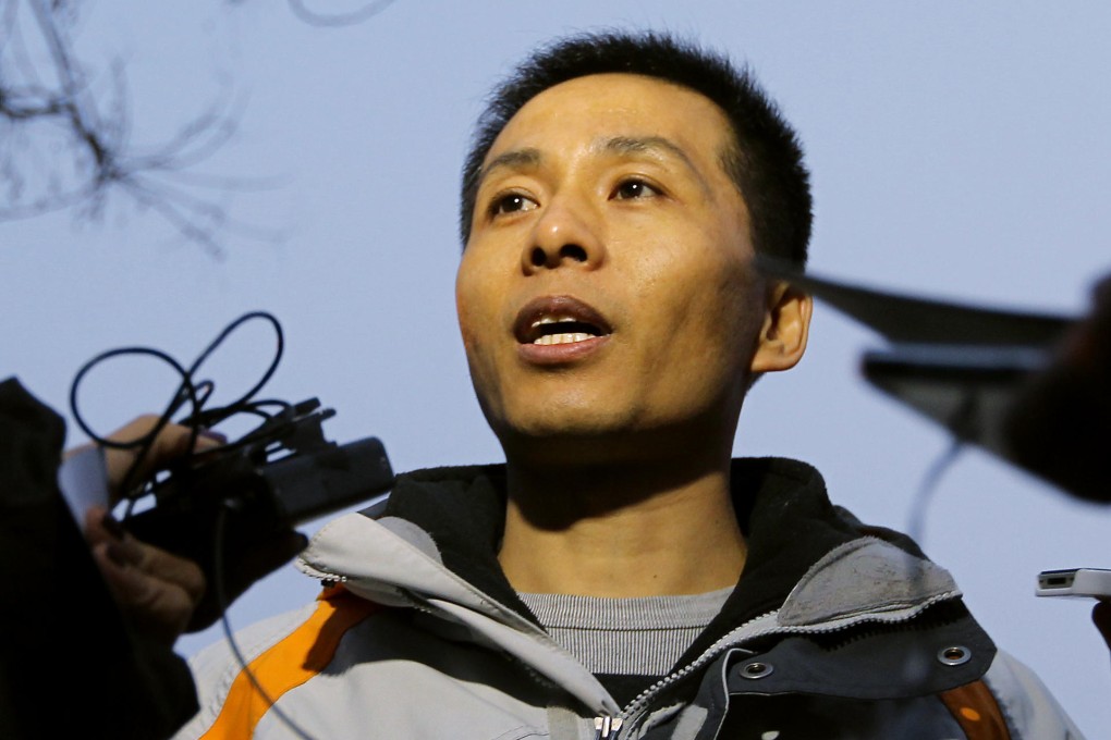 Zhu Ruifeng talks to the press after leaving the police station in Beijing. He said he had more incriminating material. Photo: Simon Song