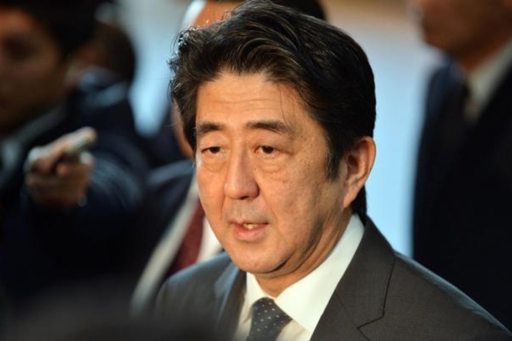 Japanese Prime Minister Shinzo Abe is pushing for aggressive action to weaken the yen. Photo: AFP