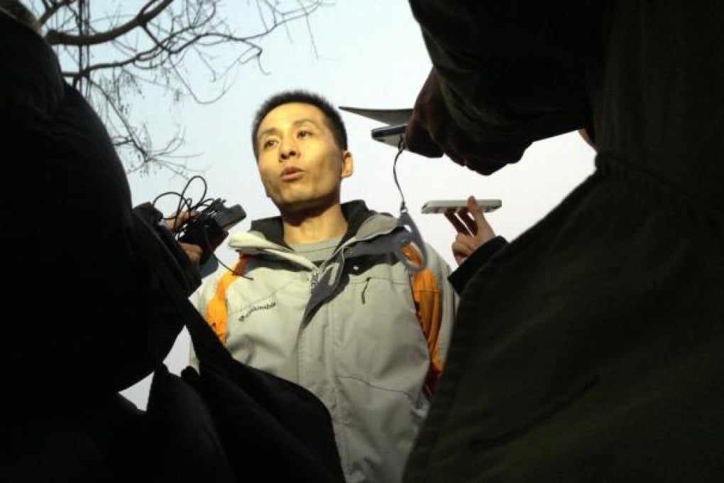 Whistle-blower Zhu Ruifeng speaks to reporters after being questioned by police for a whole day in Beijing on January 28. Photo: SCMP/Simon Song