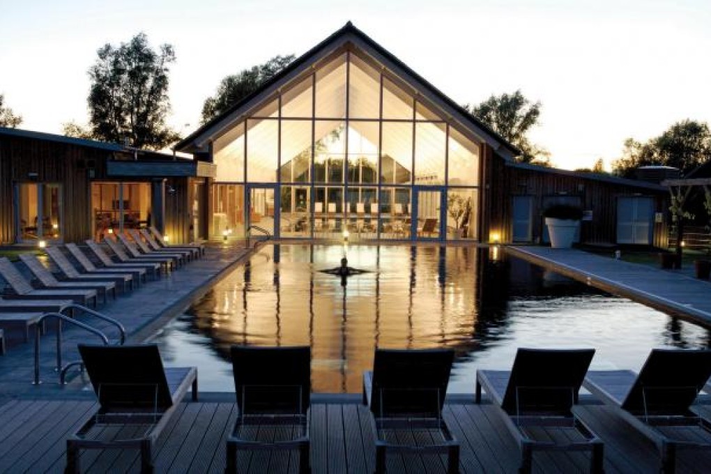 One of the two heated pools at the Lower Mill Estate in the Cotswolds, with the indoor spa and eco pool at the back. Photo: SCMP