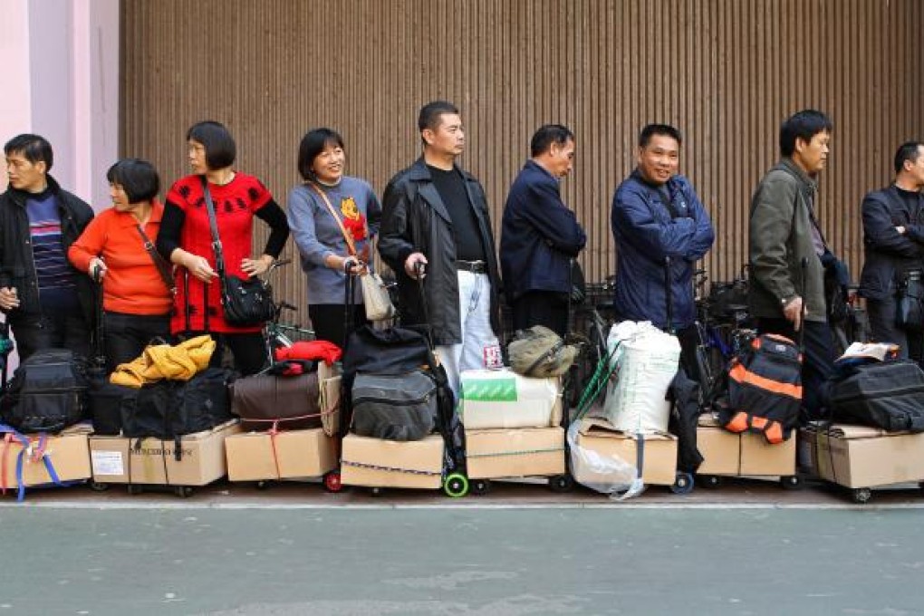 An influx of parallel traders in Hong Kong who purchase items tax-free such as baby milk formula is causing growing unrest with local residents. Photo: AFP