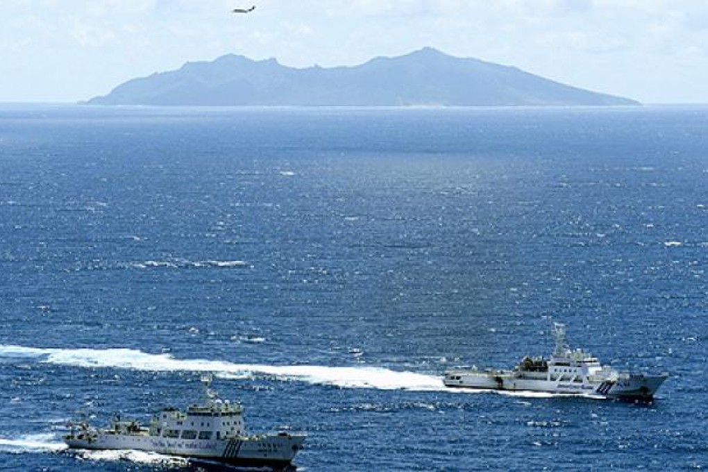 A Chinese surveillance ship and the Japan Coast Guard sail near the dispute islands. Photo: Reuters