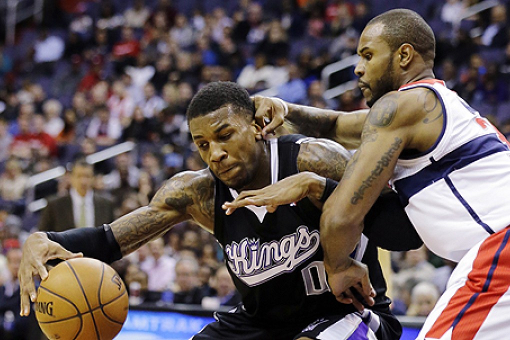 Washington Wizards' Trevor Booker (left) takes on Sacramento Kings' Thomas Robinson on Monday. The Wizards will play the Brooklyn Nets on February 8. Photo: AP