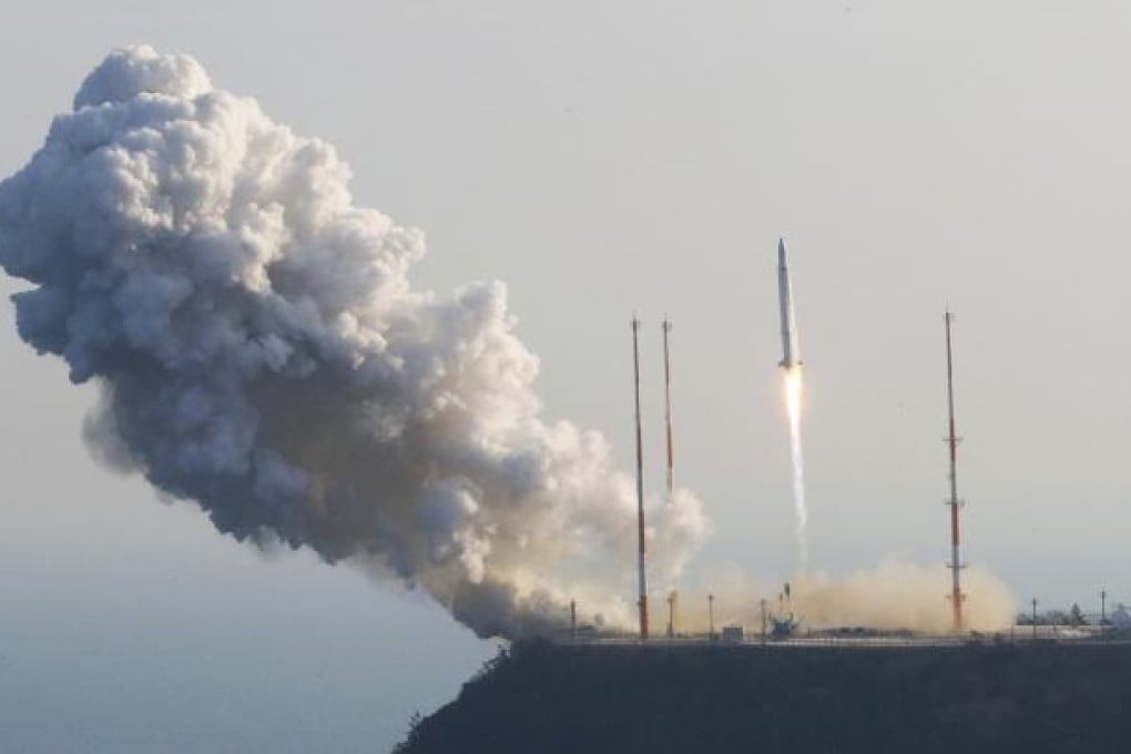 A rocket carrying a science satellite lifts off from the launch pad at the Naro Space Centre in Goheung, South Korea, yesterday. Photo: AP