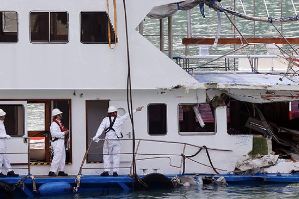 Marine Department staff inspect the Lamma IV. Photo: David Wong