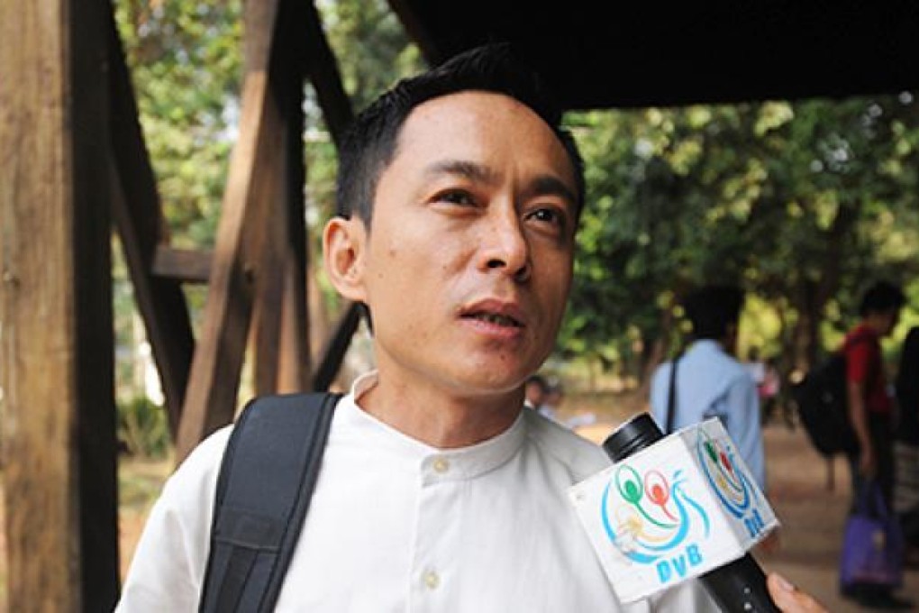 Kyaw Min Swe, chief editor of Myanmar newspaper <i>The Voice Weekly</i>, speaks to reporters following a hearing in Yangon, on Thursday. Photo: AFP