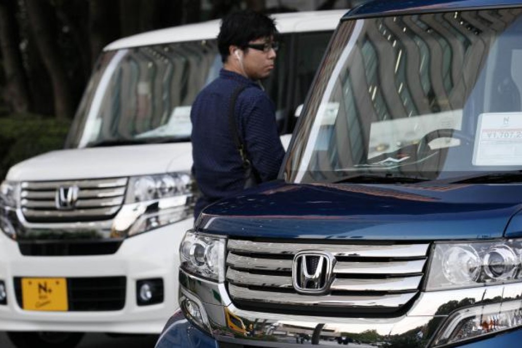 Honda cut its net income forecast for the year, basing projections on a conservative outlook for the yen. Photo: AP