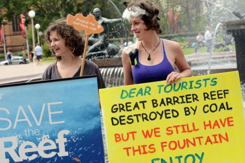 Green activists showing support for the coral reef. Photo: AFP