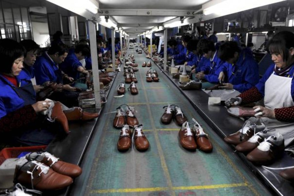 Workers process shoes at a factory in Lishui in Zhejiang province. Analysts believe the strength of new orders will continue to support an economic recovery, but some weak spots remain in areas such as exports. Photo: Reuters