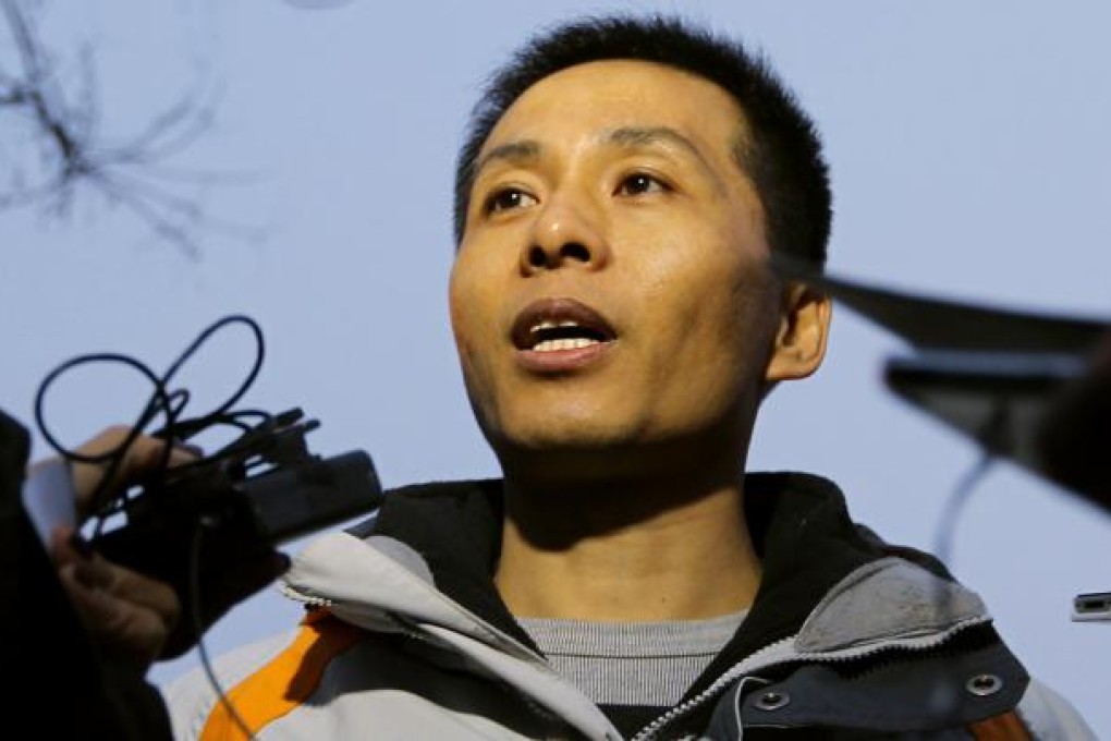 Zhu Ruifeng talks to the press after leaving the police station in Beijing. He said he had more incriminating material. Photo: Simon Song