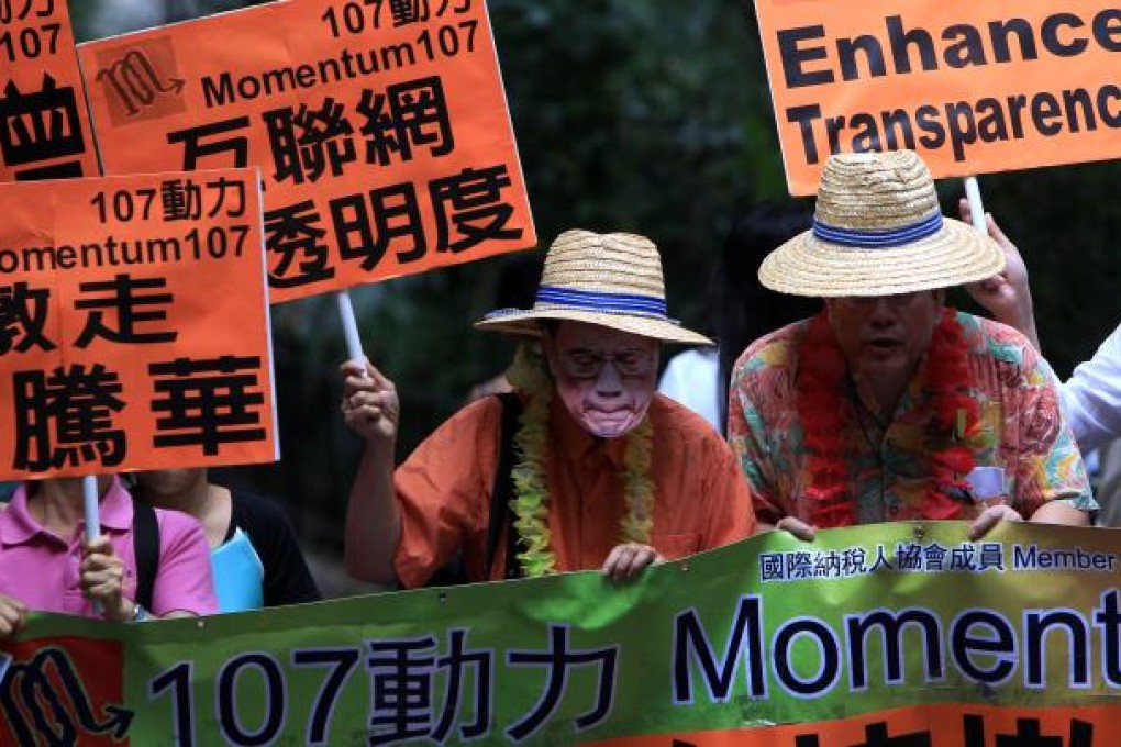 Members of Momentum 107 march to the old Central Government offices to stage a street parody of Donald Tsang and Edward Yau, urging them to step down back in June last year. Photo: Jonanthan Wong