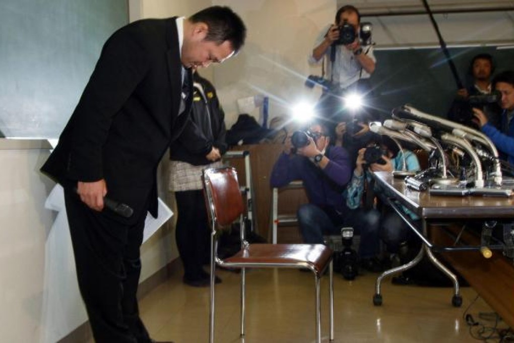 Ryuji Sonoda apologized in front of media. Photo: AFP
