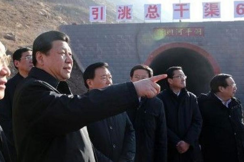 Party leader Xi Jinping on a tour of farmland in Gansu yesterday in an effort to stay in touch with the people. Photo: SCMP