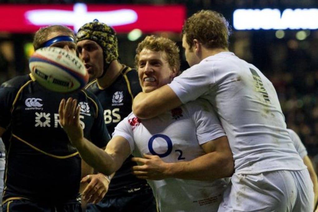 Billy Twelvetrees celebrates after scoring his try against Scotland during their Six Nations clash at Twickenham on Saturday. Photo: EPA