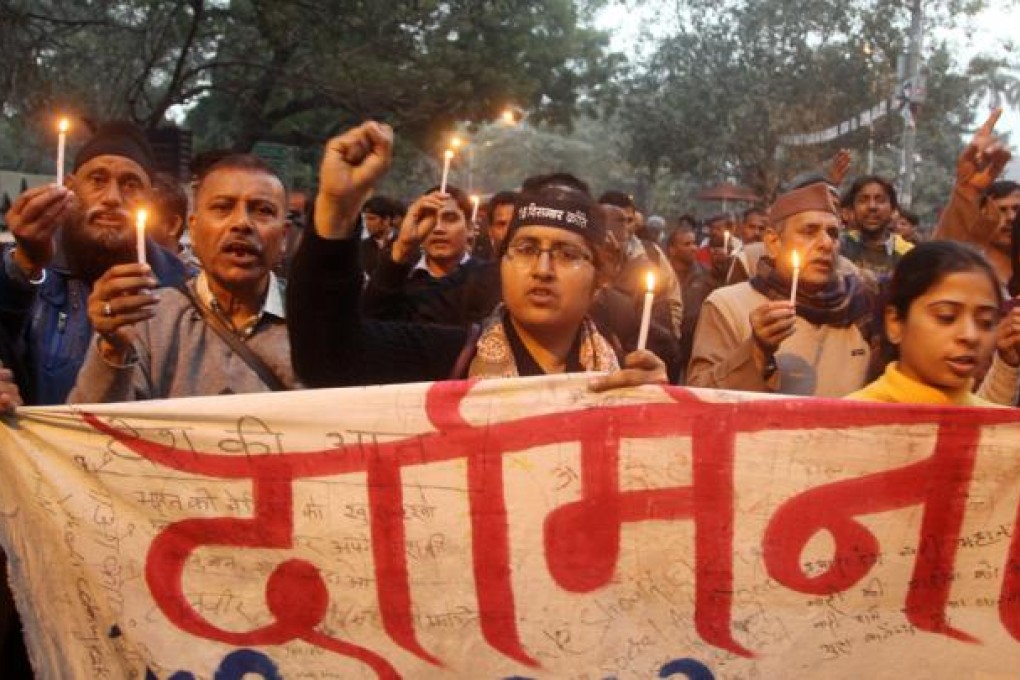 A candle light vigil held against the brutal Delhi gang-rape in New Delhi. Photo: EPA