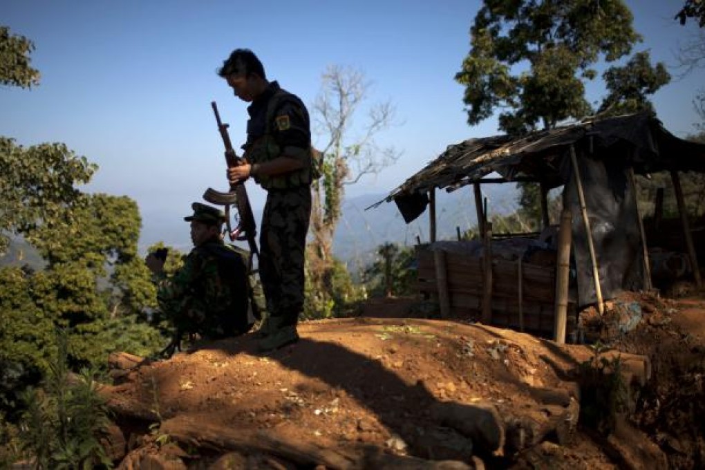 Kachin Independence Army (KIA) soldiers guard an outpost on a hilltop in Northern Myanmar. Photo: AP
