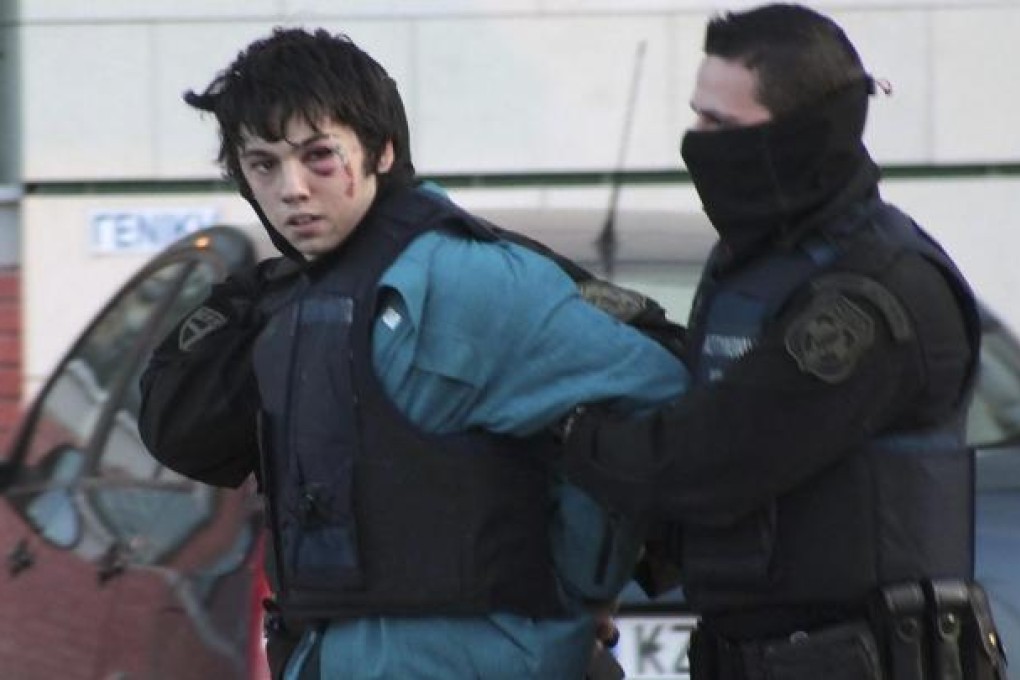 A bruised Nikos Romanos. Photo: Reuters