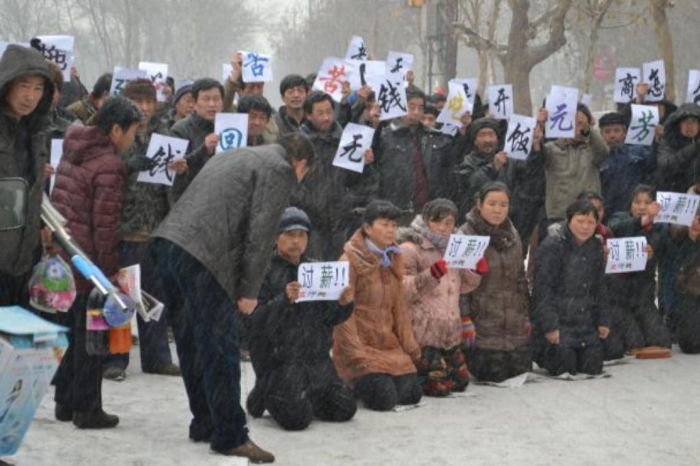 Workers protest over unpaid wages in Hebei. Photo: ImagineChina