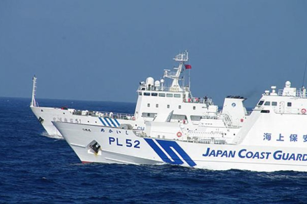 Two Chinese state vessels spent much of Monday in waters around the islands, the Japan Coast Guard said. Photo: EPA
