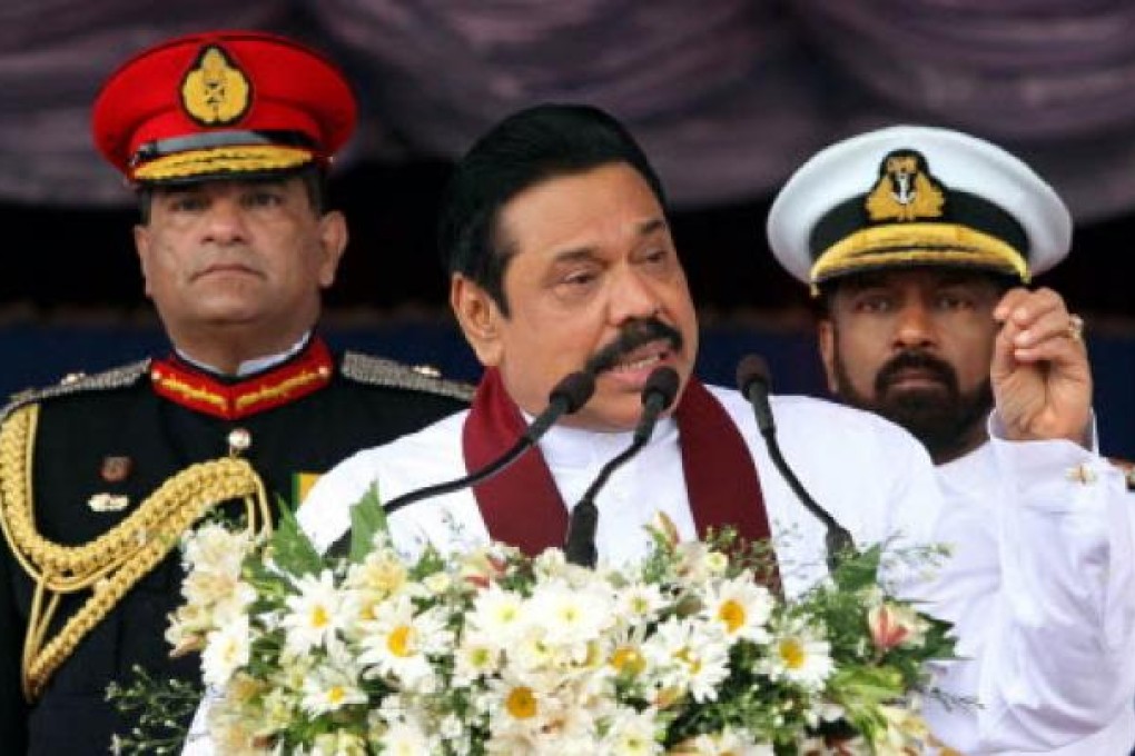 Sri Lankan President Media Division shows Sri Lankan President Mahinda Rajapaksa (centre) addressing the nation. Photo: EPA
