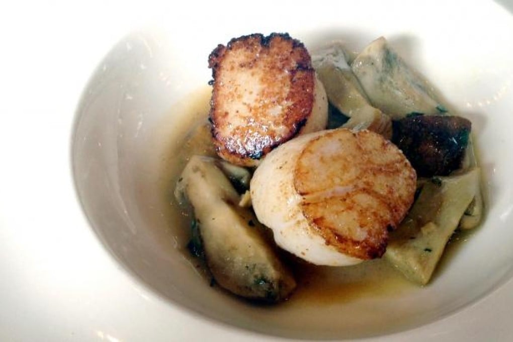 Scallop with braised potato, porcini and balsamic vinegar.