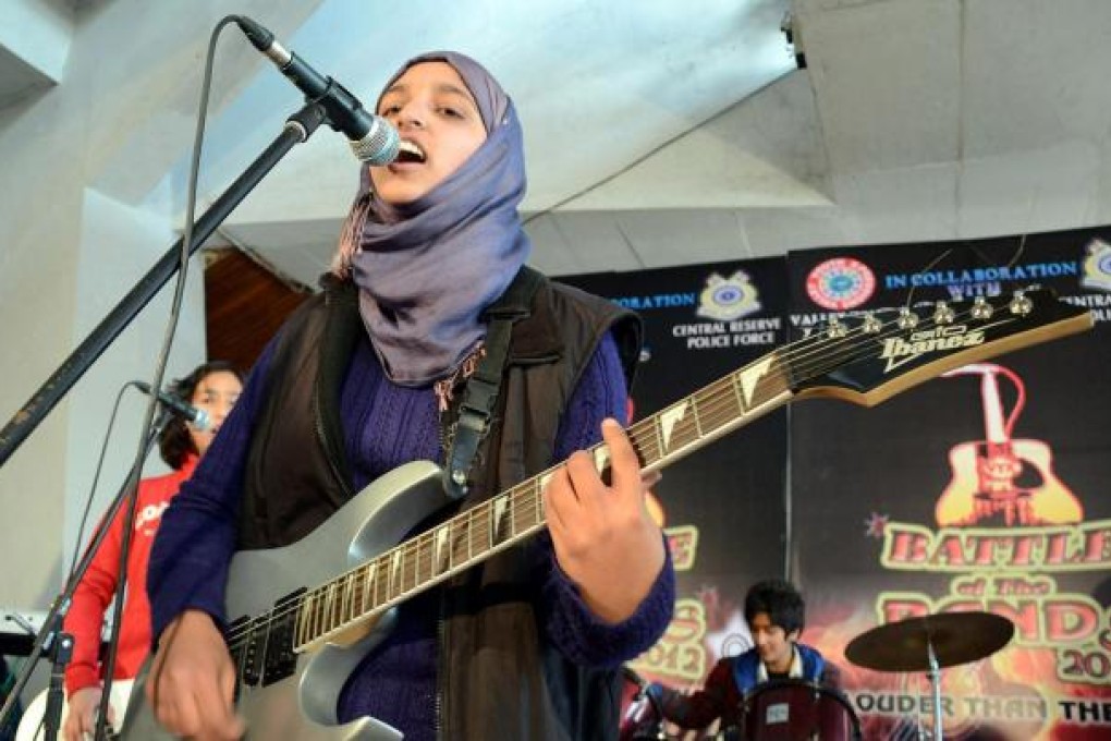 Kashmir’s first girl rock band, Pragaash, perform at the annual Battle of the Bands in Srinagar in December. Photo: AFP