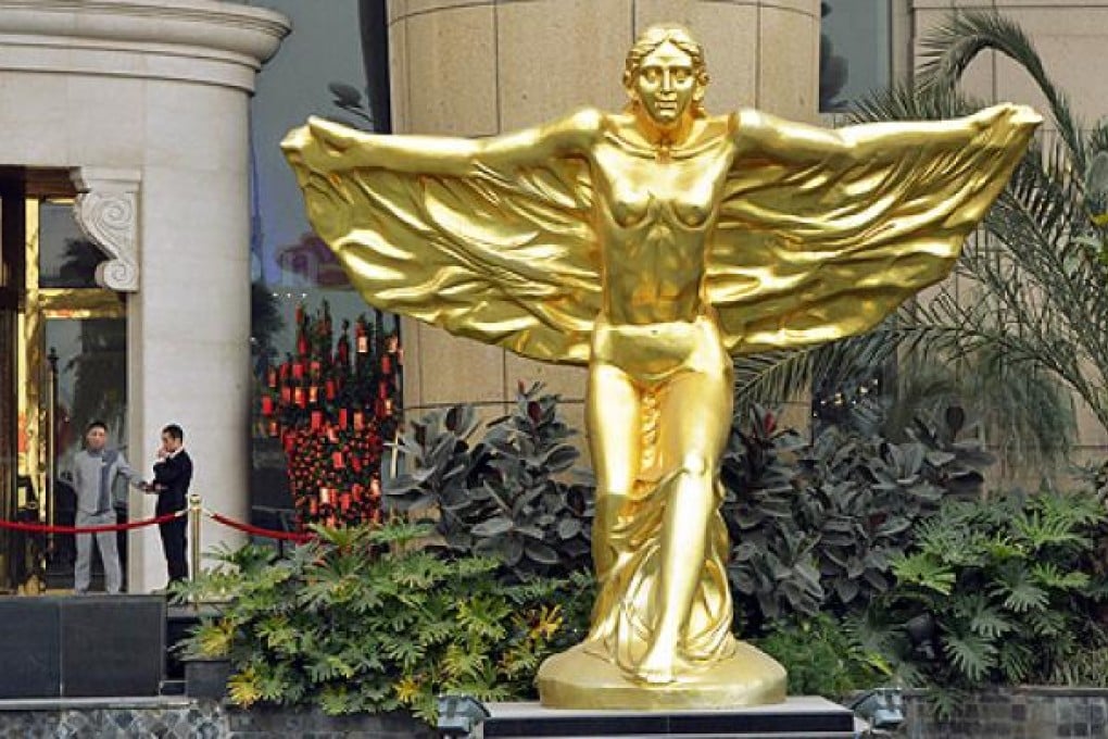A statue of a guardian angel stands outside a hotel frequented by Neil Heywood in the Nan'an district of Chongqing, which was politically loyal to Bo Xilai. Photo: AFP