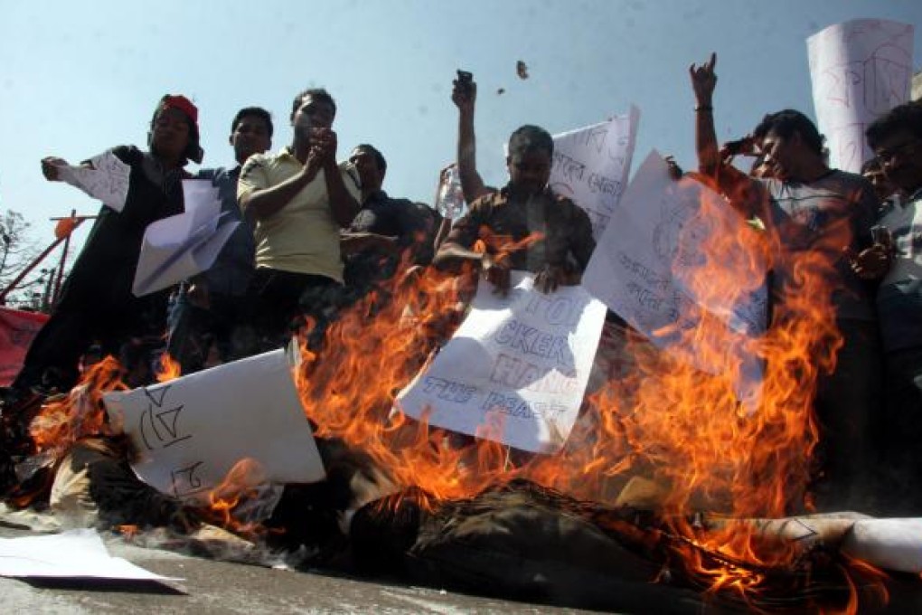 Protesters angry at Molla's conviction. Photo: Xinhua