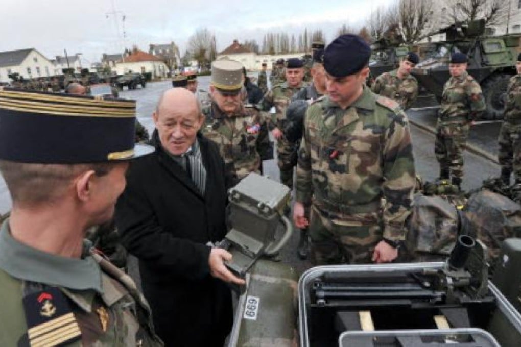 French defence minister Jean-Yves Le Drian (2nd Left) meets soldiers from the third RIMA (Marine Infantry Regiment) on Tuesday in Vannes, France. Photo: AFP