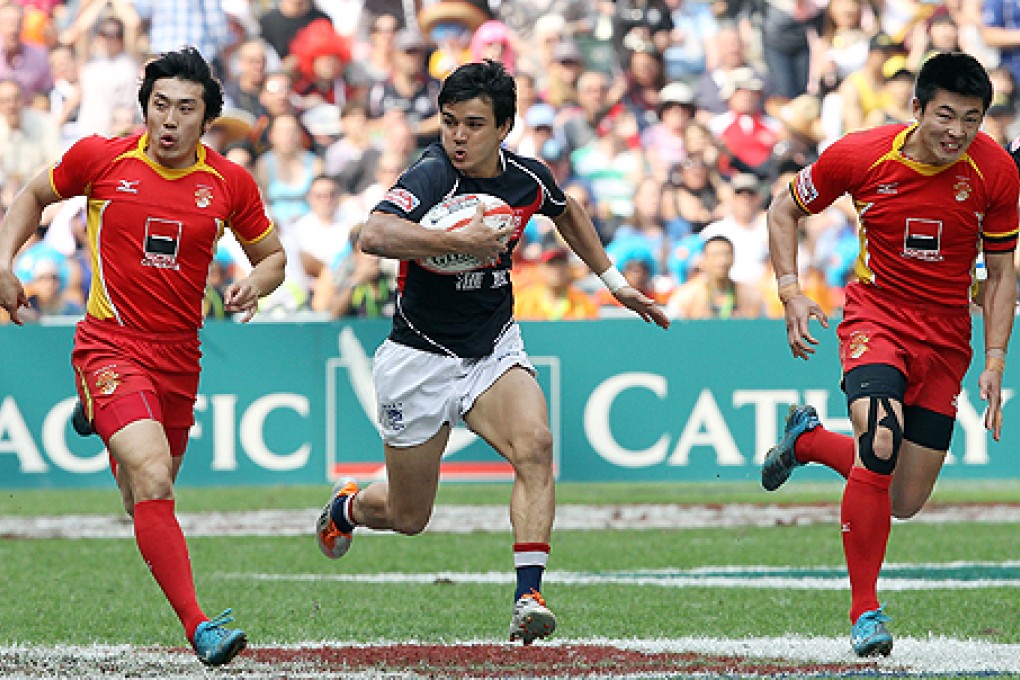Hong Kong's Keith Robertson makes a run for it against China in last year's Sevens tournament at Hong Kong Stadium in Wan Chai. Photo: David Wong