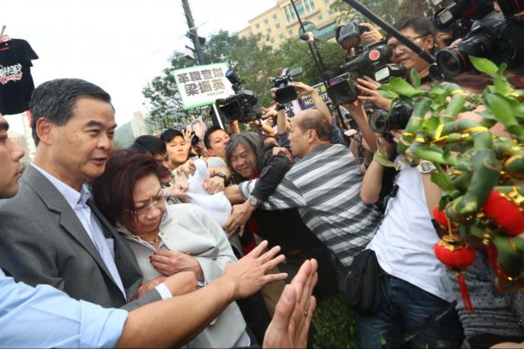 Chief Executive Leung Chun-ying and his wife Regina Leung Tong Ching-yee visit Chinese New Year Fair Stall at Victoria Park. Photo: Sam Tsang
