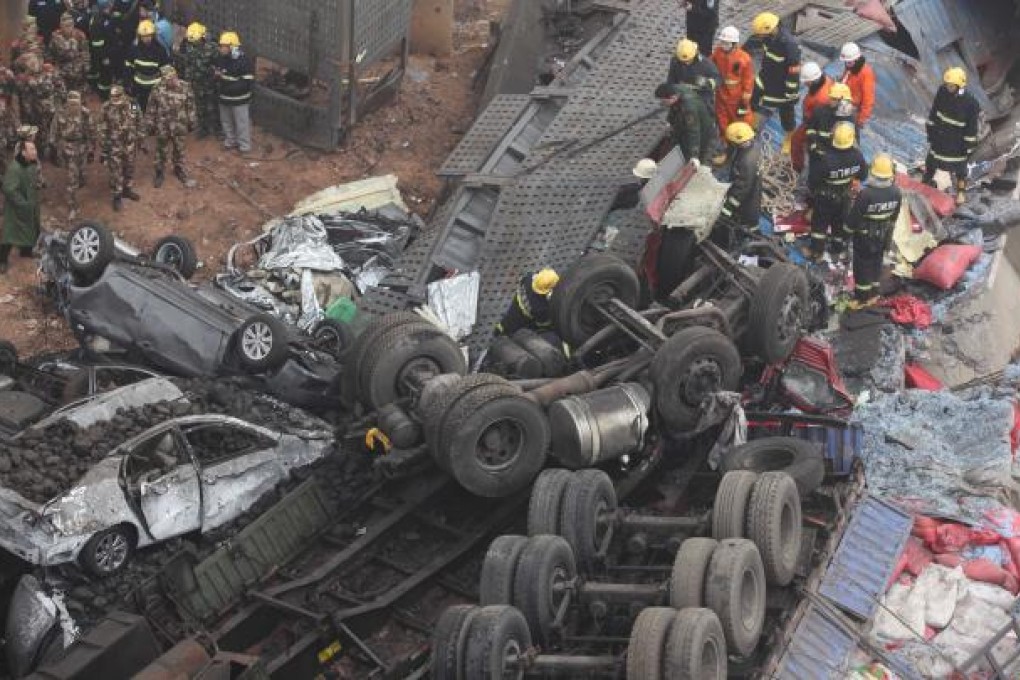 Vehicles plummeted 30 metres from a bridge after a truck carrying fireworks exploded and caused a section of the highway to collapse. Photo: Xinhua