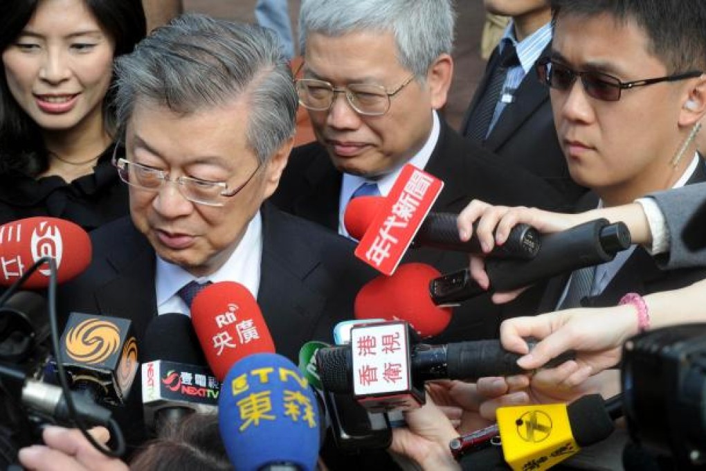 Premier Sean Chen faces the press after formally announcing his resignation. Chen has said he is stepping aside for health reasons. Photo: AFP
