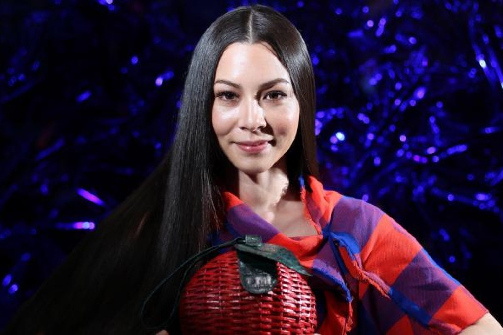 China Chow with a Nancy Gonzalez bag.