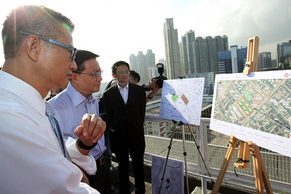 Secretary for Development Paul Chan Mo-po (left) and Secretary for Transport and Housing Professor Anthony Cheung Bing-leung visit a proposed site for public housing in Sham Shui Po. Photo: Dickson Lee
