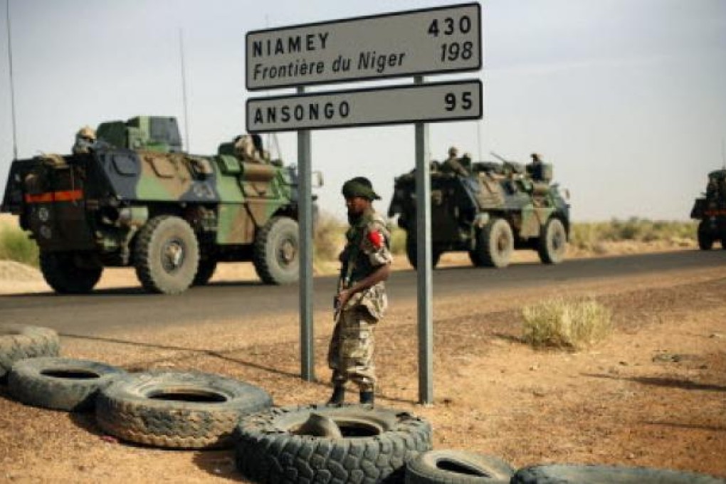 French armoured vehicles are seen heading towards the Niger border before making a left turn north in Gao, northern Mali. Photo: AP