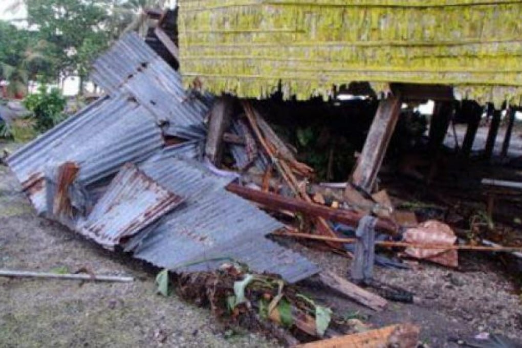 Damage to homes in the village of Louva, caused by a tsunami in the Santa Cruz Islands region of the Solomons Islands. Photo: AFP