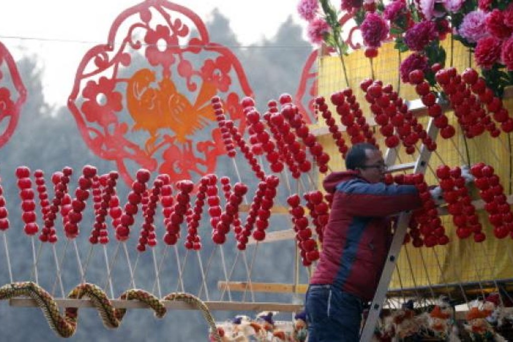 A snake-shaped doll is displayed at a shop during the temple fair in Ditan Park, also known as the Temple of Earth, in Beijing on Saturday. Photo: AP