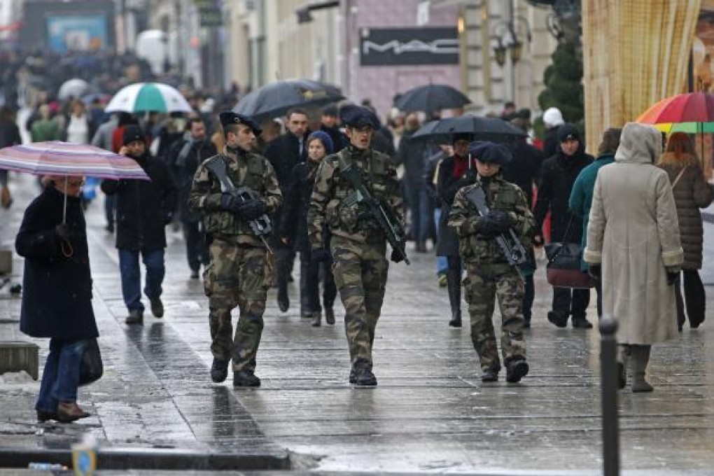 French soldiers patrol on the Champs Elysees avenue in Paris as part of the "Vigipirate" heightened security plan. Photo: Reuters