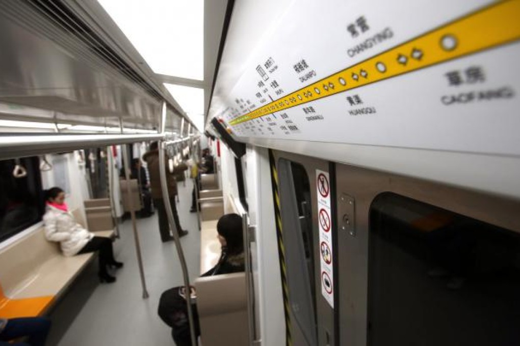 Passengers in a train on Beijing's subway line 6. Photo: Xinhua