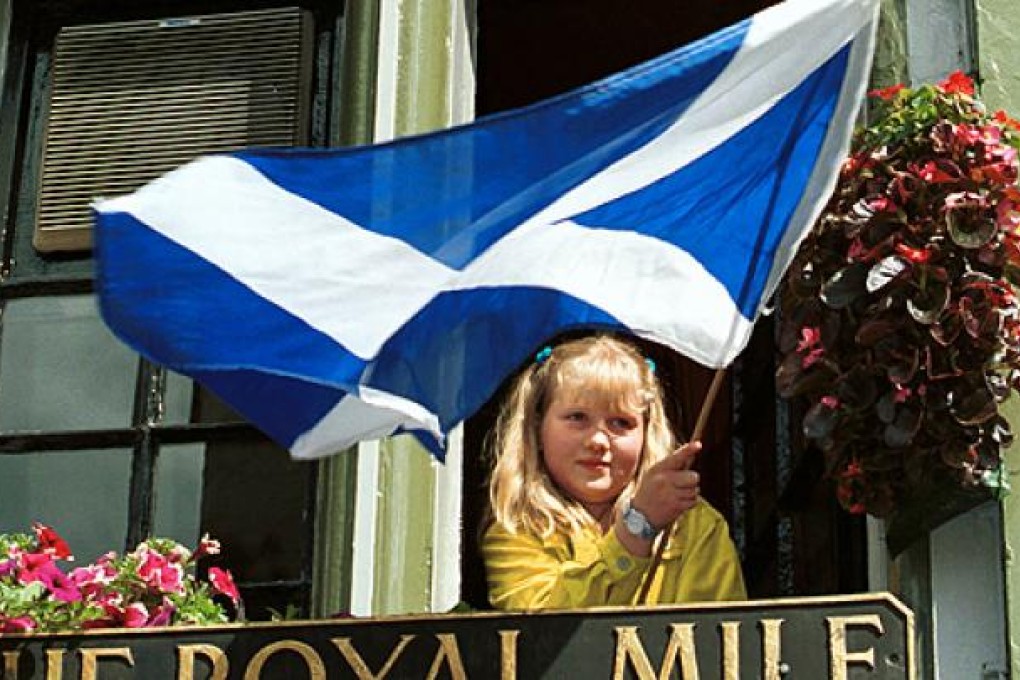 The Scottish flag is waved in Edinburgh. Photo: AP