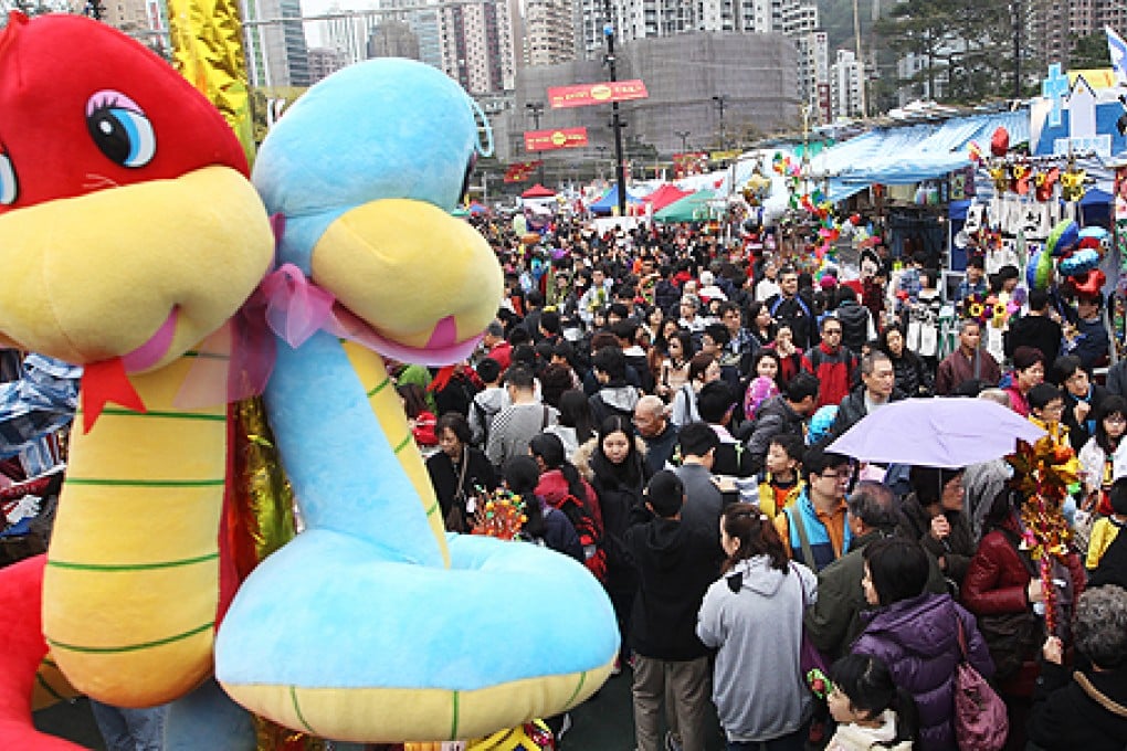 There's ssssomething about sssnakes. The Lunar New Year fair at Victoria Park draws a crowd. Photo: Sam Tsang