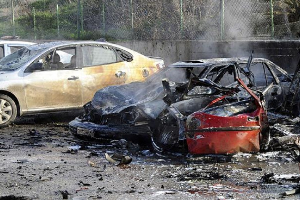 Damaged cars are seen after an explosion at Cilvegozu border gate on the Turkish-Syrian border in Hatay province. Photo: Reuters