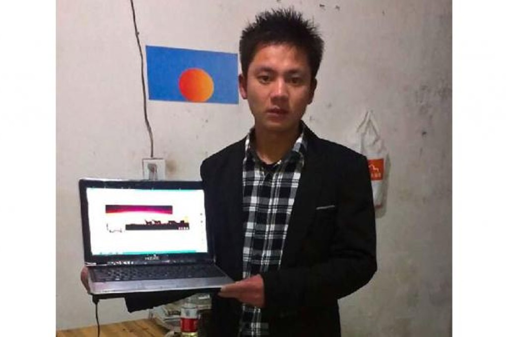 Zhang Hungming poses with his personal computer, which he runs the popular fan page for the Communist Party's General Secretary Xi Jinping. Photo: AP