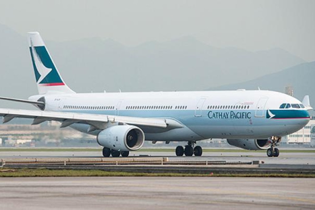 A Cathay Pacific plane sits on the tarmac at Chep Lap Kok. Photo: AFP